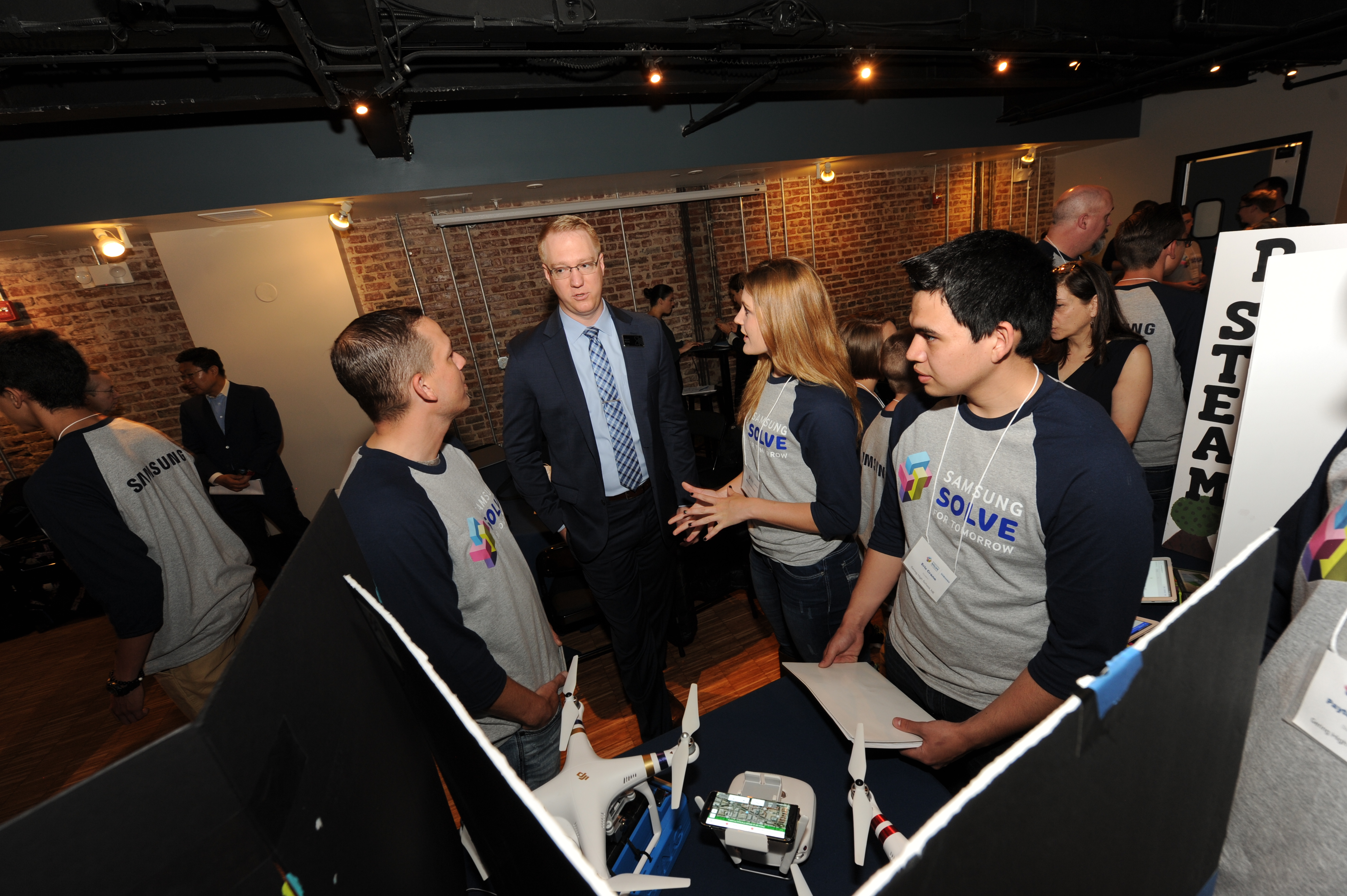 (From left) Justin Reinmuth, judge Elliot Mork of Project Lead the Way, Elexus Johnson and Eric Crane.