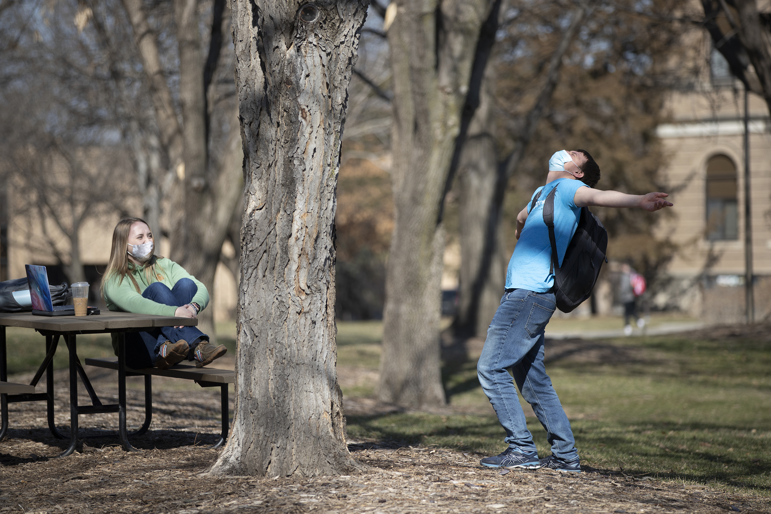 Students enjoy the warm weather on East Campus. After record-breaking cold weather in February 2021, winter this year has been mild and dry.