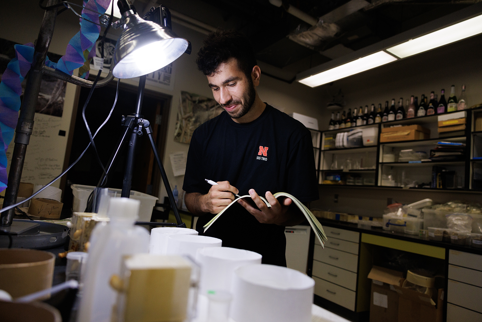 Abdallah Abdallah, an incoming UNL freshman from Lincoln, documents a spider’s activity while working in Eileen Hebets lab.