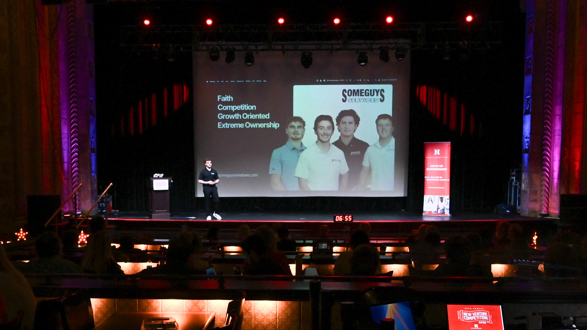 Jackson Donley, a sophomore management major from Bloomington, Minnesota, pitches his startup, SomeGuys Services onstage at the Rococo Theatre.