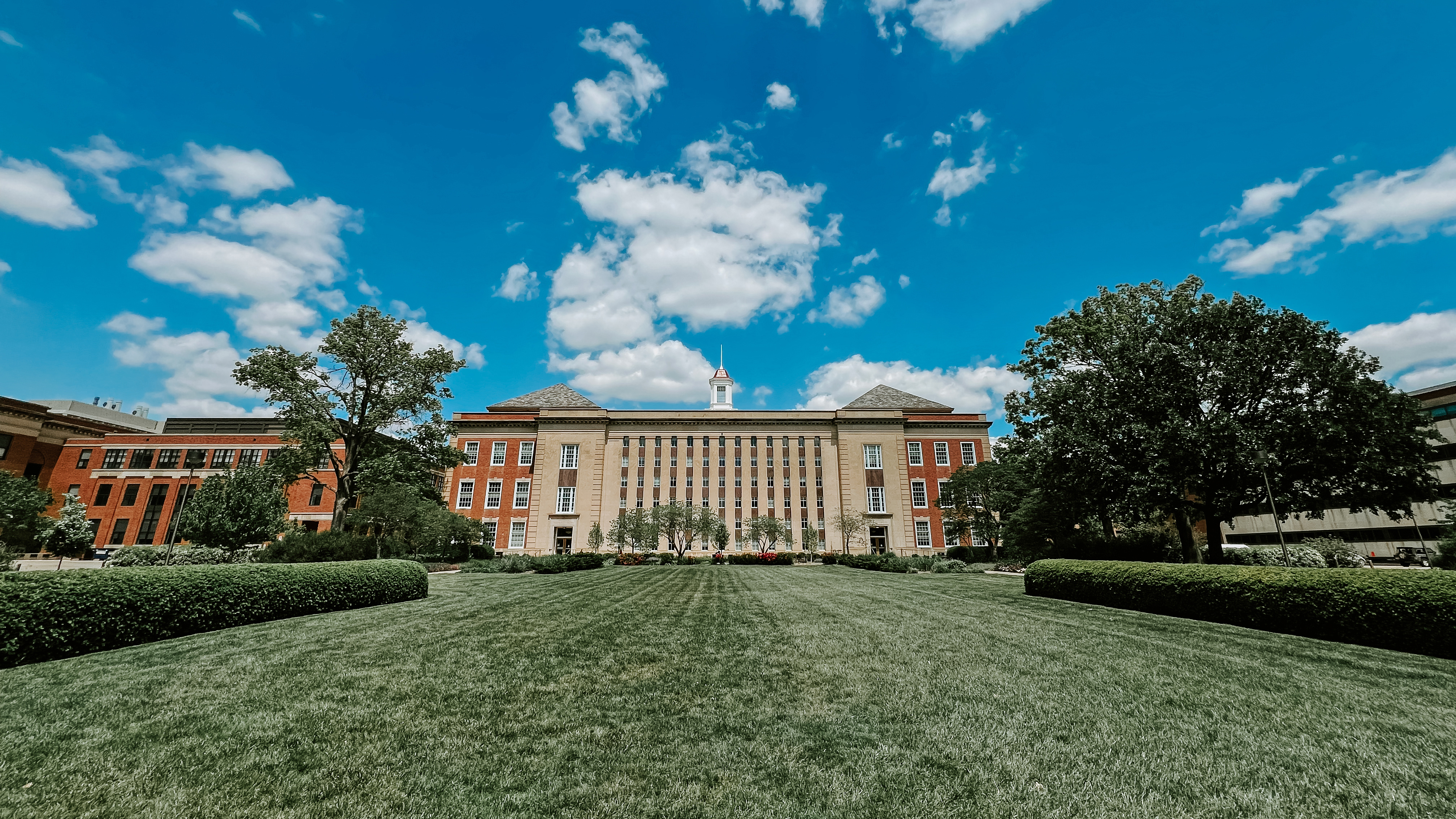 The Love Library South lawn on a partly cloudy day.