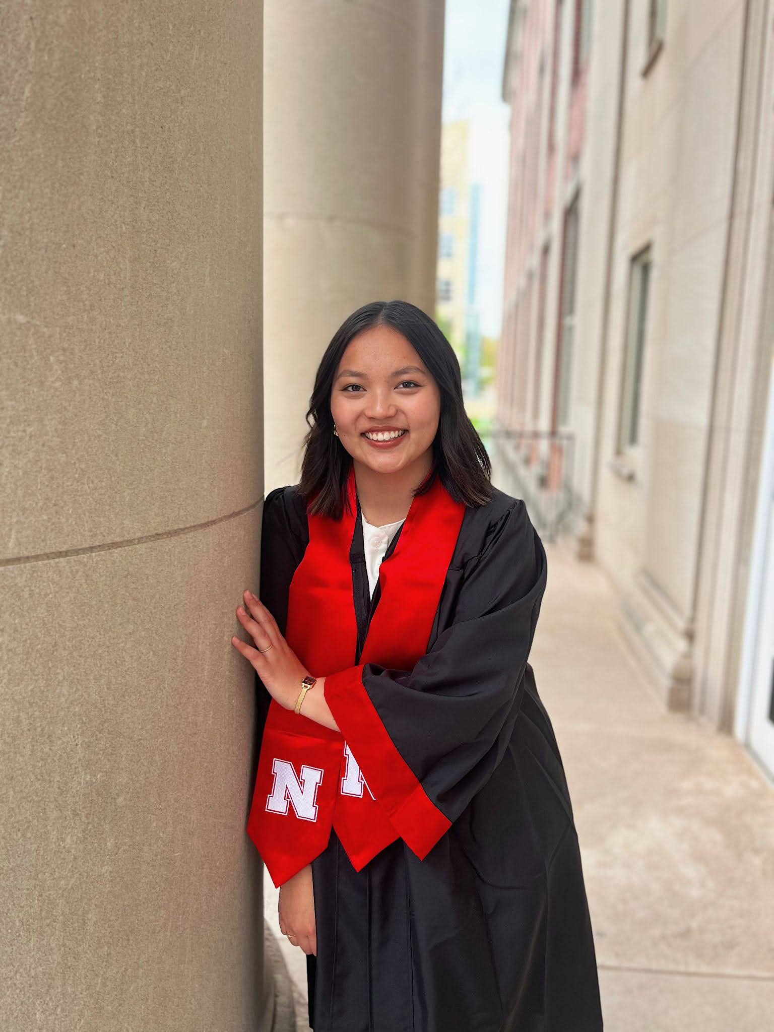 Color portrait of Rowan Havranek, University Honors Program member and May graduate, wearing graduation regalia.