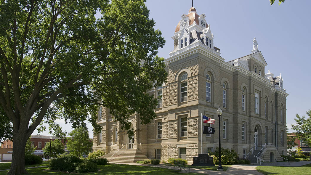 The Jefferson County courthouse, a tall square building made of brownstone.