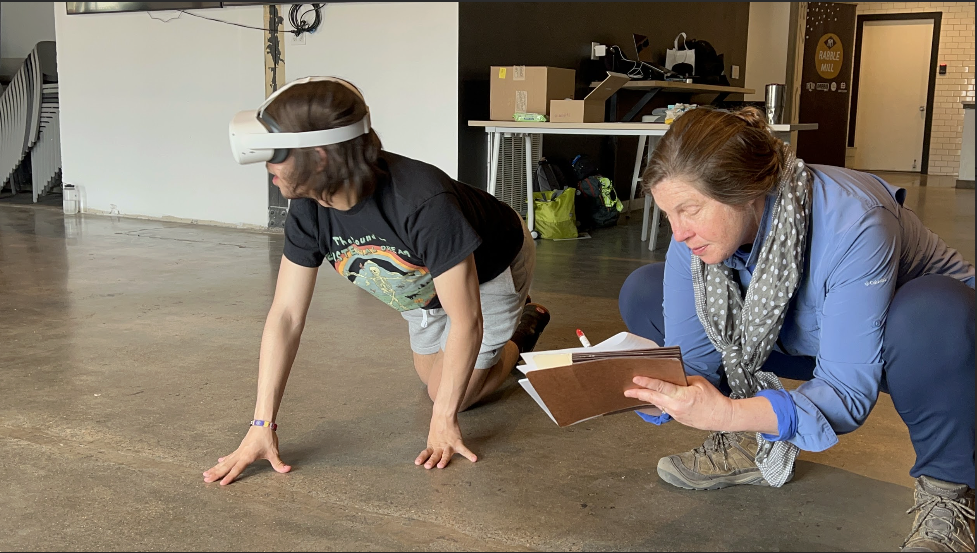 Sociologist Julia McQuillan (right) takes notes while a youth tests "MuMu."