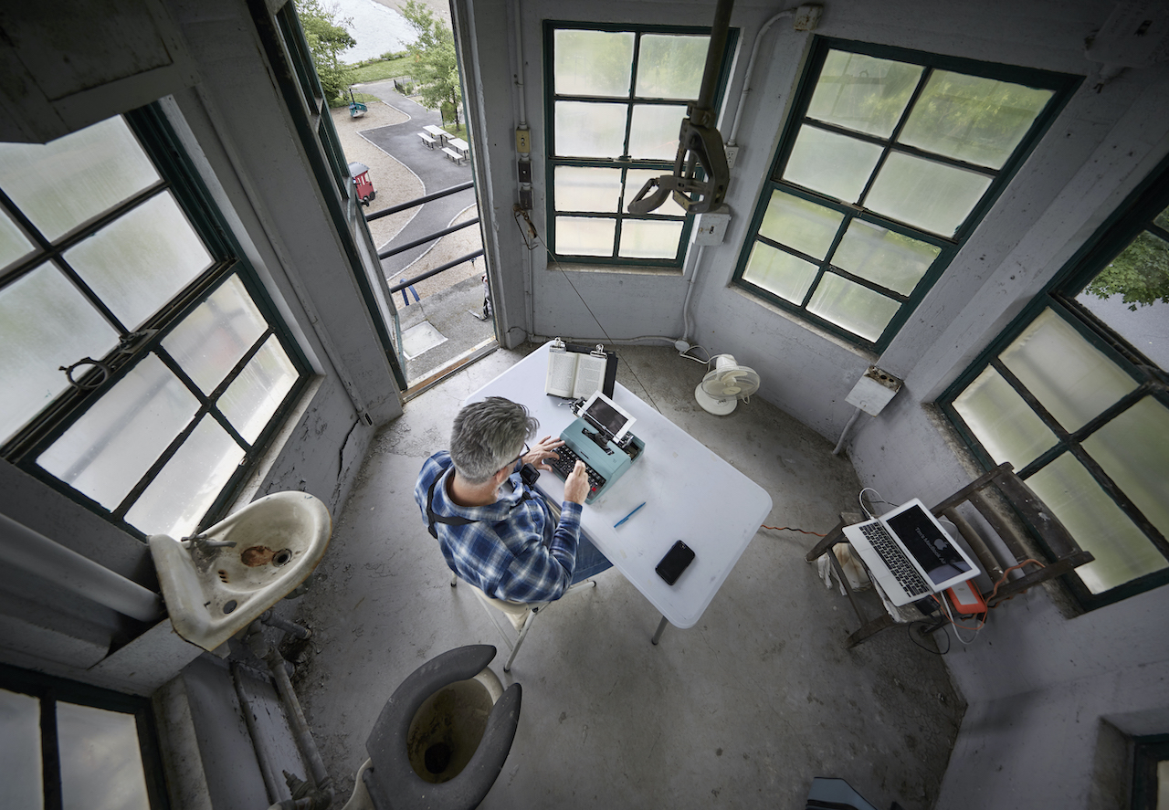 Tim You retyping John Cheever’s Falconer. 211 pages typed on an Olivetti Lettera 32. Decommissioned guard tower at Sing Sing Prison, Ossining, NY, June 2018.