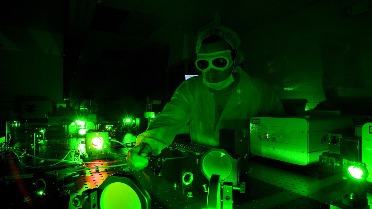 A technician adjusts the Diocles Laser in UNL's Extreme Light Laboratory. The lab is led by Donald Umstadter, one of four UNL researchers featured in the first report from the University of Nebraska's National Strategic Research Institute.