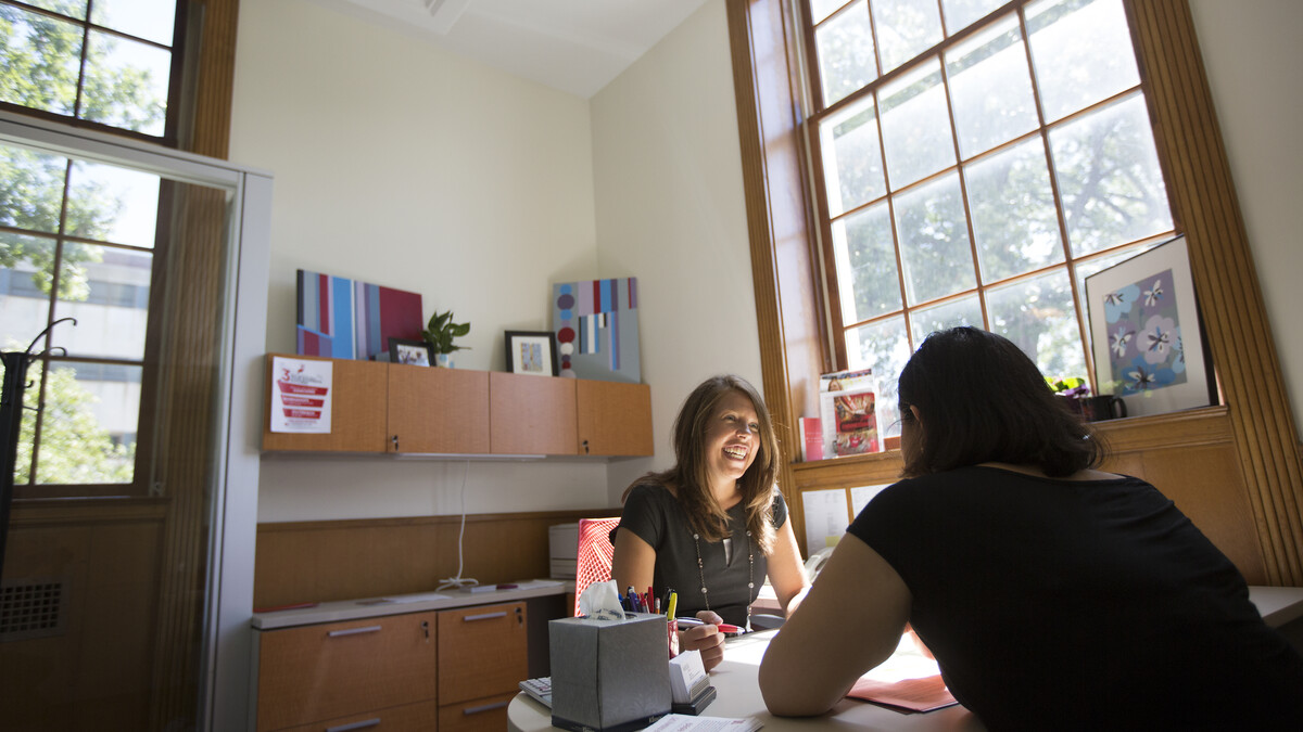 Katie Kerr, assistant director of UNL's Exploratory and Pre-Professional Advising Center, assists a student during an academic advising session at the start of the fall semester. More than 1,000 students on academic probation have participated in a new UNL program that helps chart a path toward academic success.