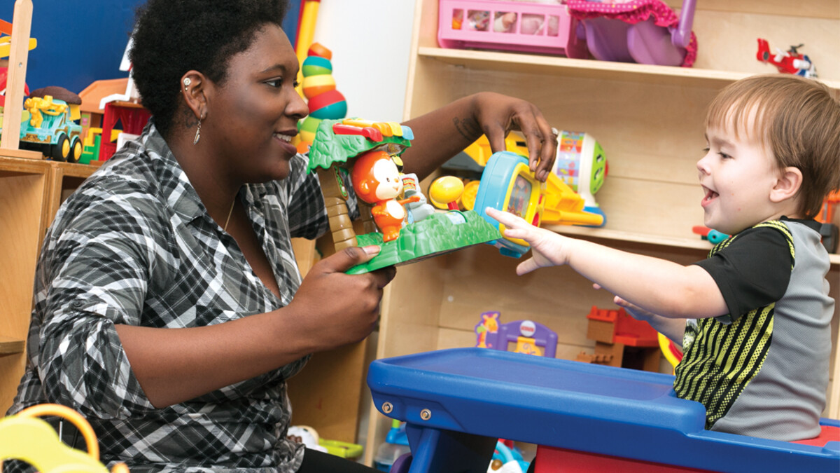 Micheale Marcus works with a child as part of the university's early childhood autism spectrum disorder training program.