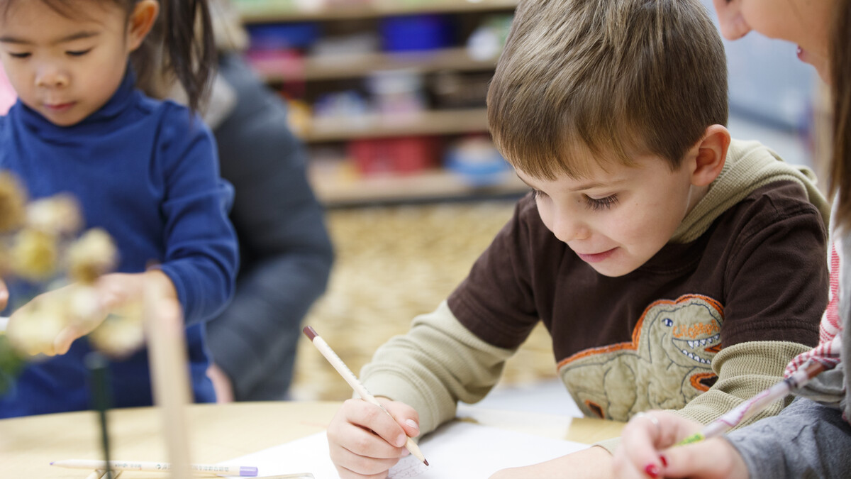 A student works with a child at the Ruth Staples Child Development Laboratory