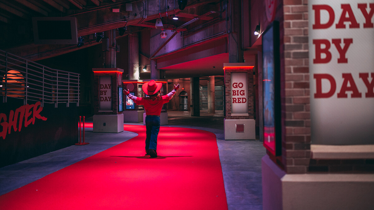 Herbie Husker walks the Tunnel Walk route in Memorial Stadium after morning practice.