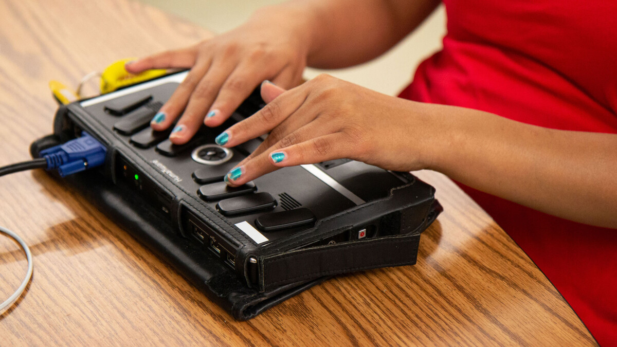 Using a Braille writing machine, a student writes a paper at the Nebraska Center for the Education of Children who are Blind or Visually Impaired in Nebraska City.