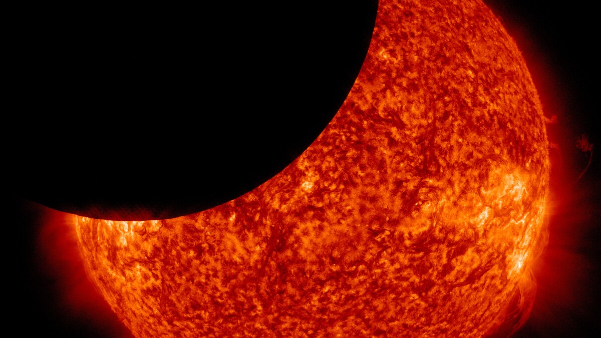 Color image of the Jan. 30, 2014, partial solar eclipse captured by NASA's Solar Dynamics Observatory.