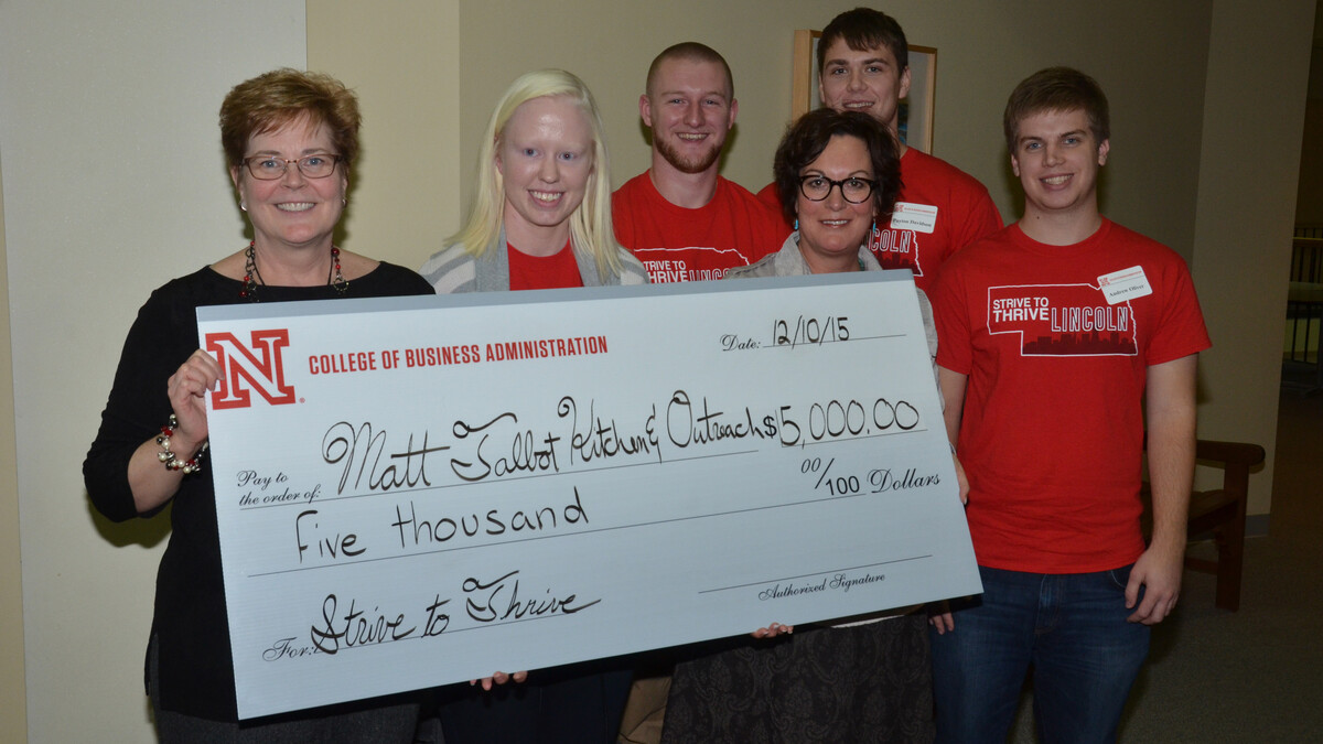 Matt Talbot Kitchen and Outreach representatives Sally Buchholz (left), director of development, and Susanne Blue, executive director, hold a $5,000 check from the Strive to Thrive Lincoln project. Also pictured are (from left) UNL students Liz Thompson, Matt Peck, Payton Davidson and Andrew Oliver, who participated in the class that made the grant decisions.