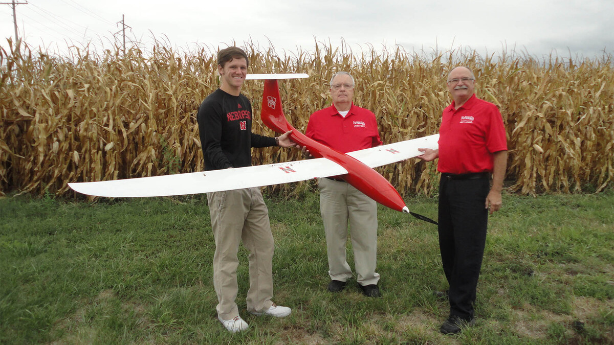 (From left) Matt Headrick, George Meyer and Wayne Woldt conduct a preflight check on an unmanned aircraft system.