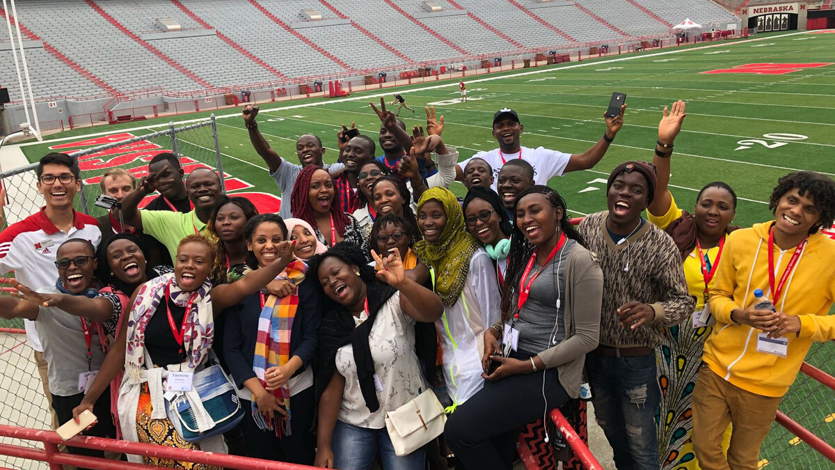 The 2018 Mandela Washington Fellows pose in Memorial Stadium during a group tour.
