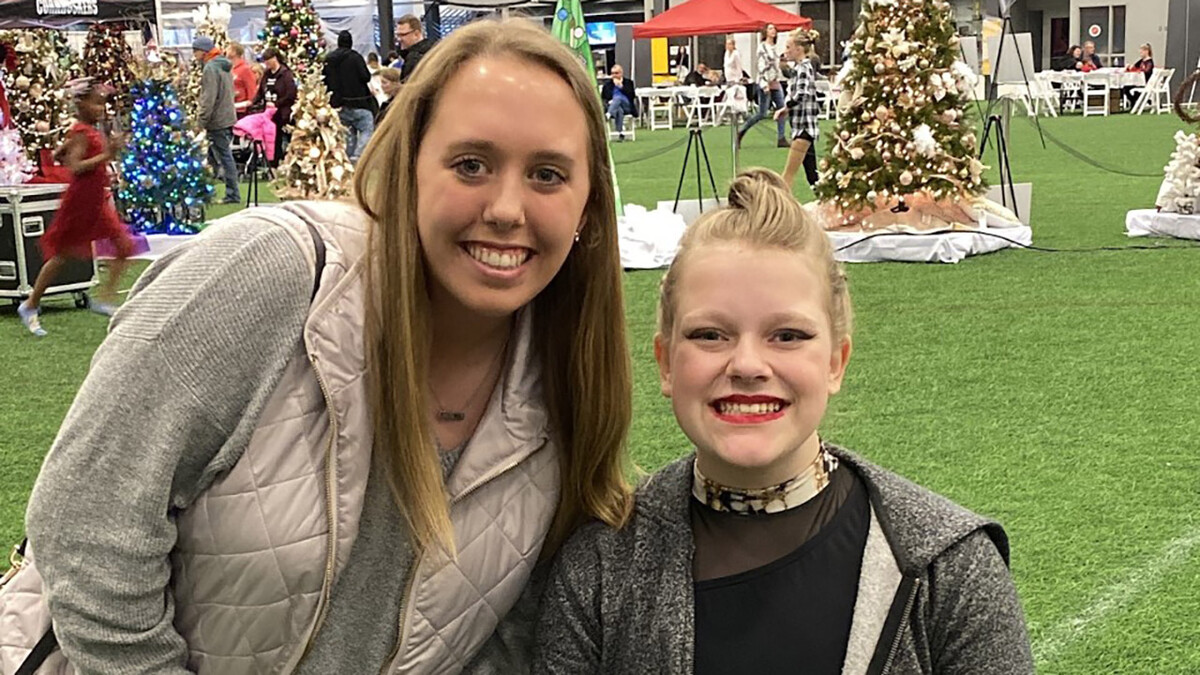 Ashley McMurchie, a junior microbiology and Spanish major from Omaha, cheers on her leadership mentee, Lily, a 16-year-old high school student from Lincoln, in this photo taken before the COVID-19 pandemic.