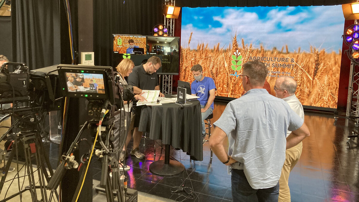 Jill Hochstein and others work behind scenes during the Agriculture and Health Summit, which was held in October 2021.