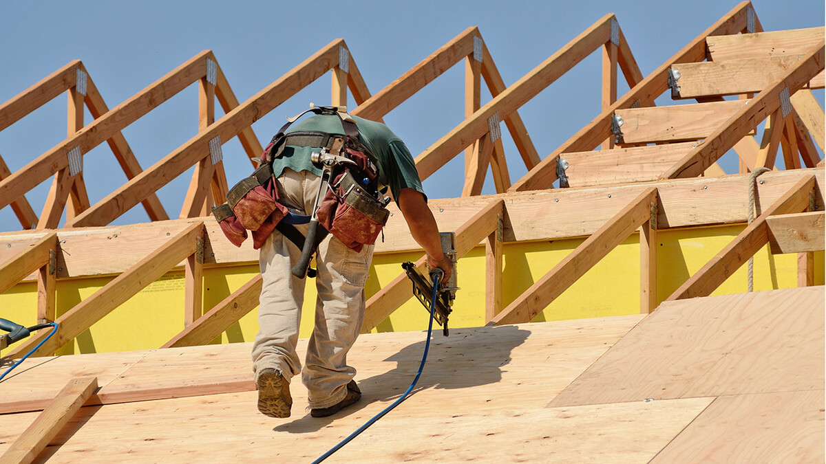 Man working on roof construction