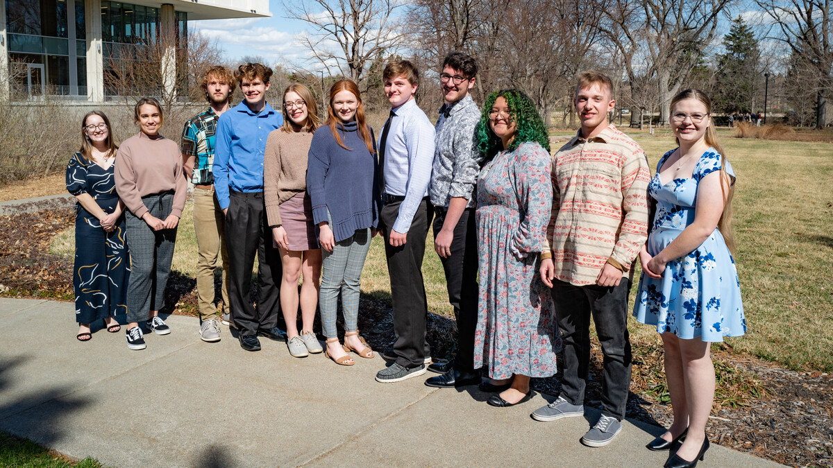 Newest Alpha Gamma Chapter inductees pose with past officers. From left are Jamie Dasenbrock, past vice president, Sage Eckard, Cole Hammett, Benjamin Knudsen, Tori Boden, Macey Wooldrik, Jacob Nichols, Jacob Hillis, Deanna Montanez Mendoza, Nathan Starr,