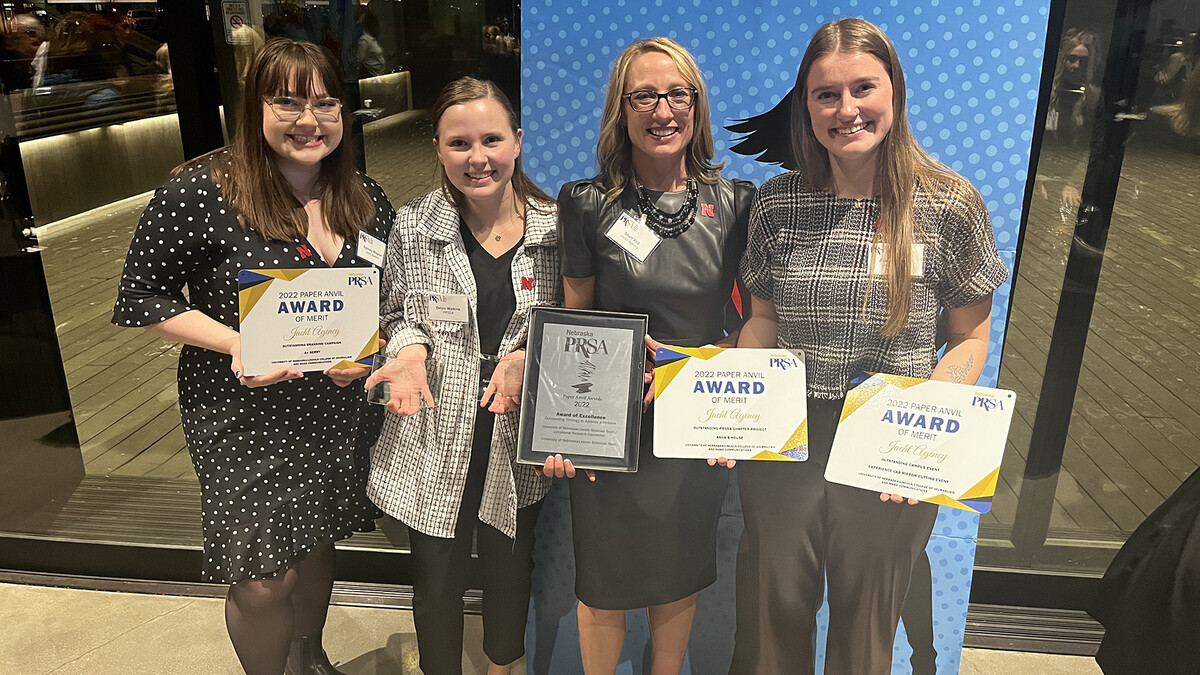 Students Sydney Wagner (left), Delani Watkins (second from left) and Zoe Matheson (right) pose with Dean Shari Veil (third from left).