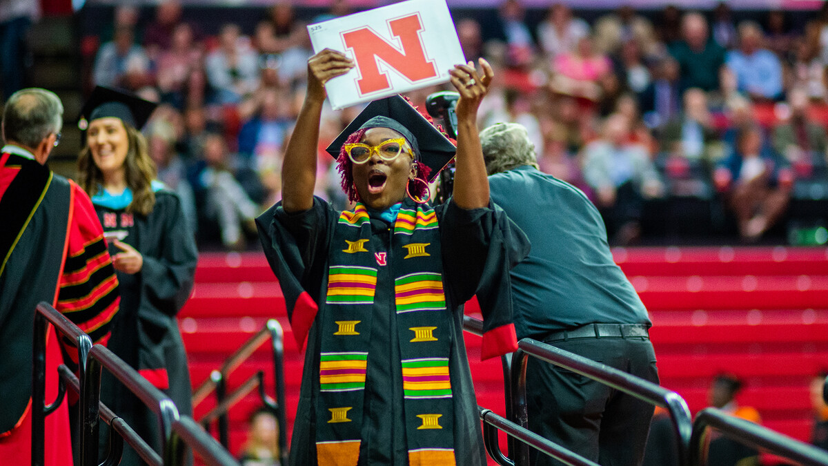 Ja'Lesa Reed celebrates after receiving her Master of Education during the graduate and professional degree ceremony May 19 at the Bob Devaney Sports Center.