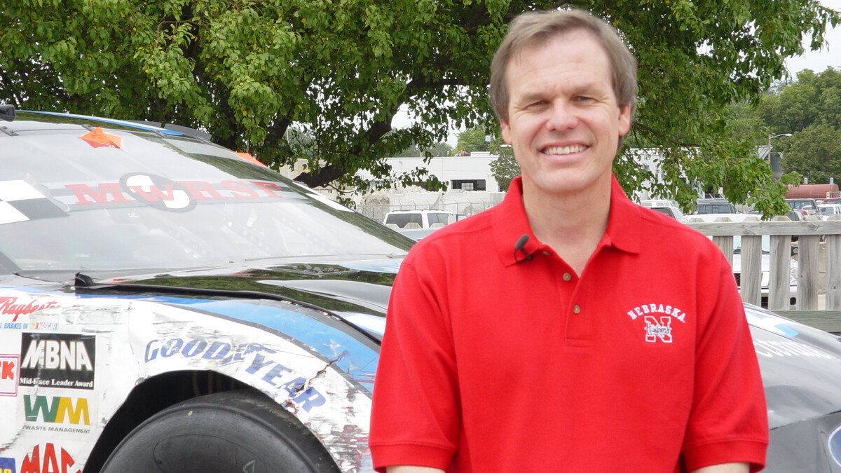 Dean Sicking stands next to a test race car in August 2004.