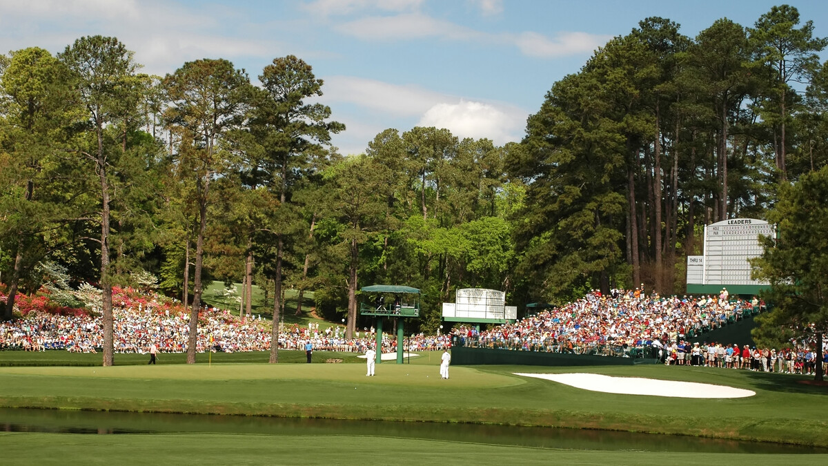 The gallery surrounds the 18th green at Augusta National Golf Club.