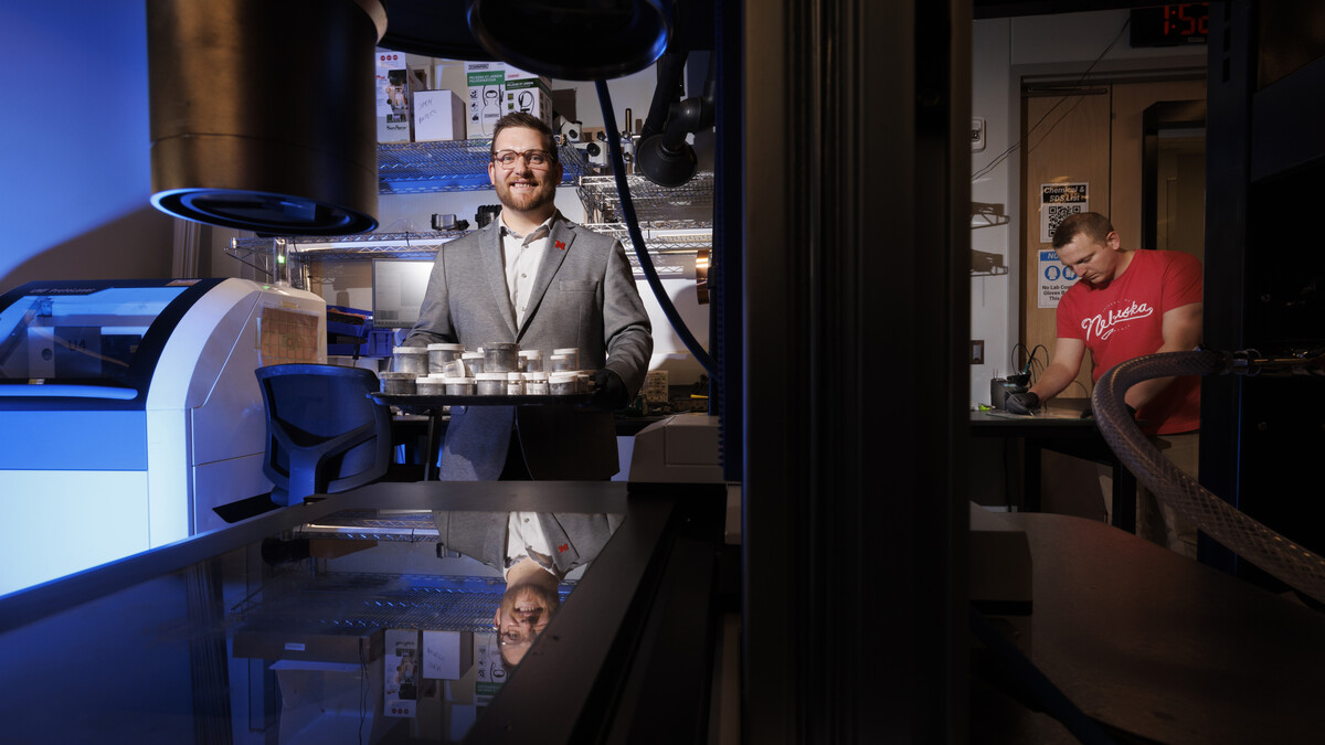 Eric Markvicka (left), Robert F. and Myrna L. Krohn Assistant Professor of Biomedical Engineering, and graduate student Ethan Krings (right) pose in a laboratory.