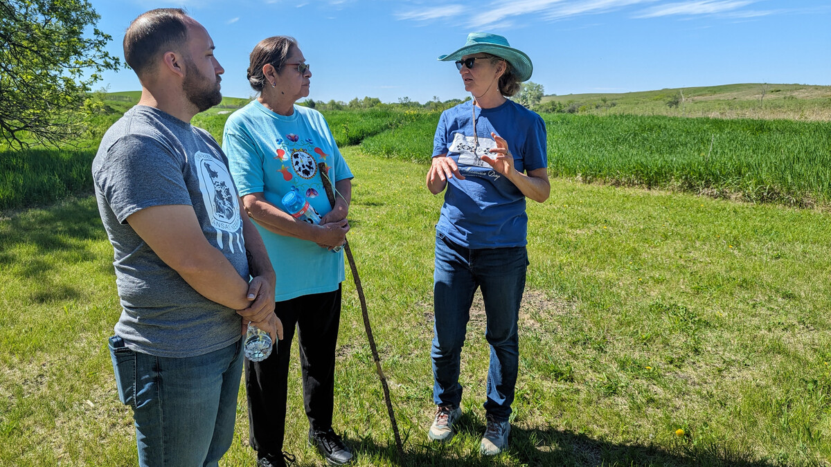 Margaret Jacobs (right), Charles Mach Professor of history, director of the Center for Great Plains Studies and co-director of the Walking in the Footsteps of Our Ancestors project, speaks with project team members Cory DeRoin and Billie Tohee (both Otoe-Missouria) at Spring Creek Prairie Audubon Center near Denton.