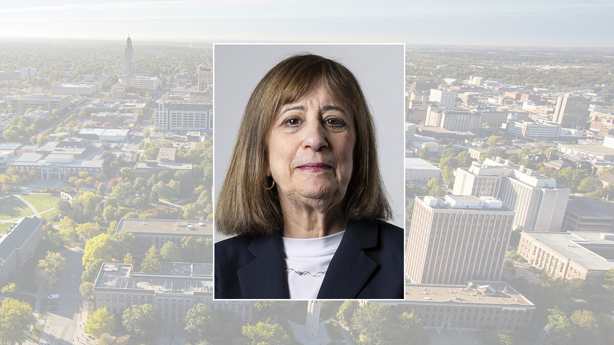 Wendy Cutler, senior vice president at the Asia Society Policy Institute and former acting deputy U.S. trade representative, on a color campus background.