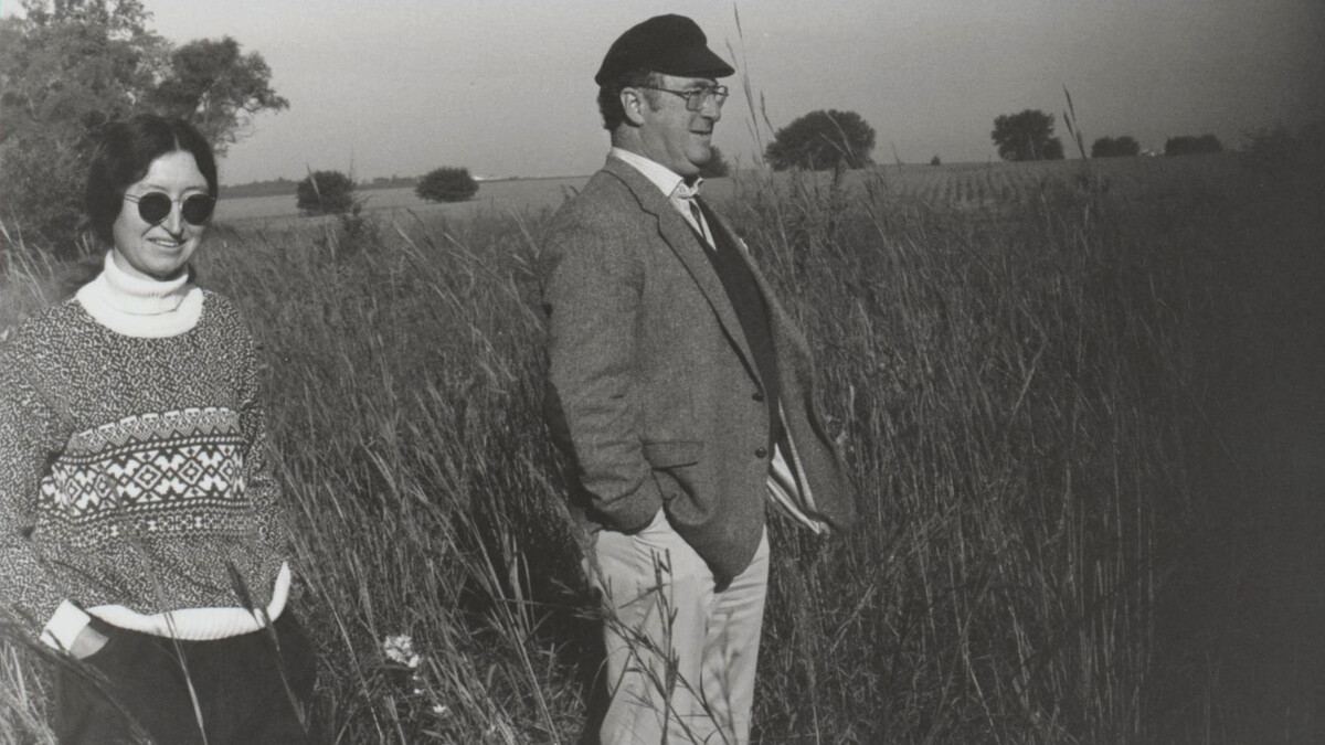Fran Kaye, professor of English, stands next to Jim McCrorie, then director of the Great Plains Research Centre at the University of Regina, in a tallgrass prairie.