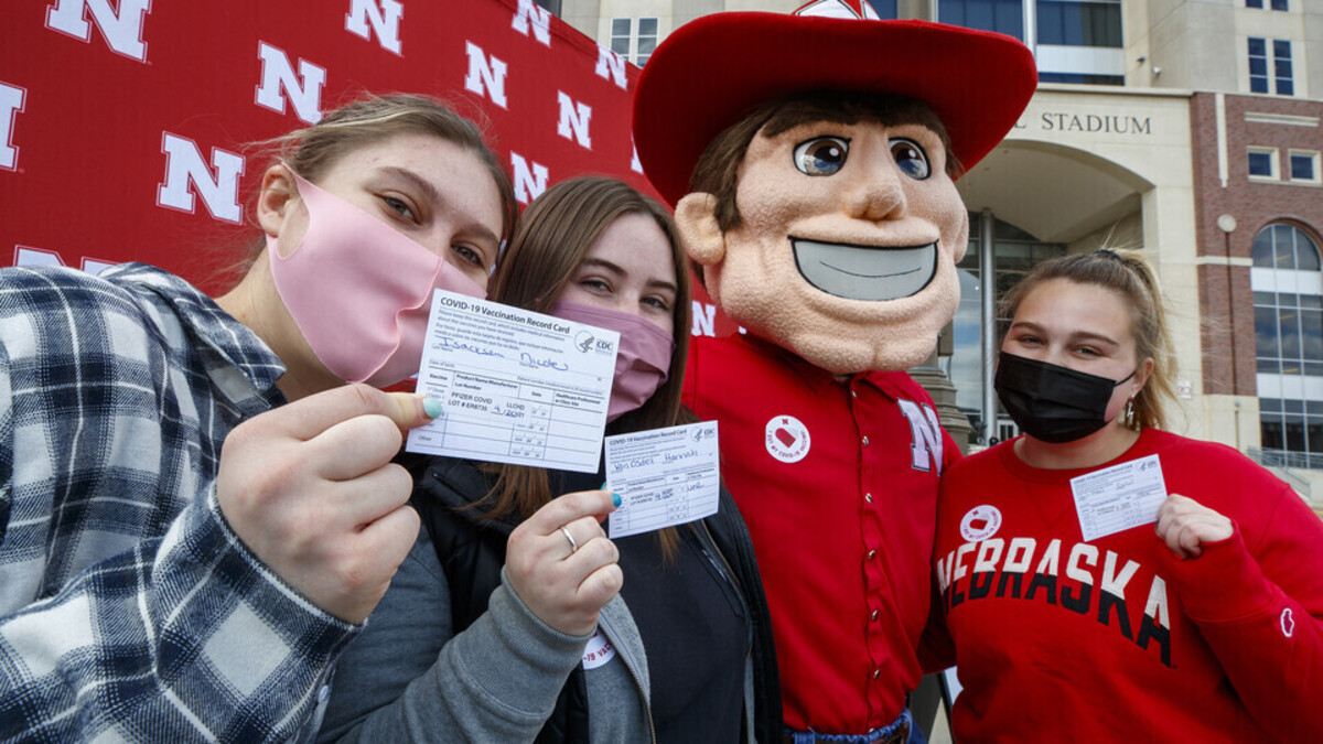 Students took time to pose with Herbie Husker after getting vaccinated in the on-campus Pfizer vaccination clinic in the spring.