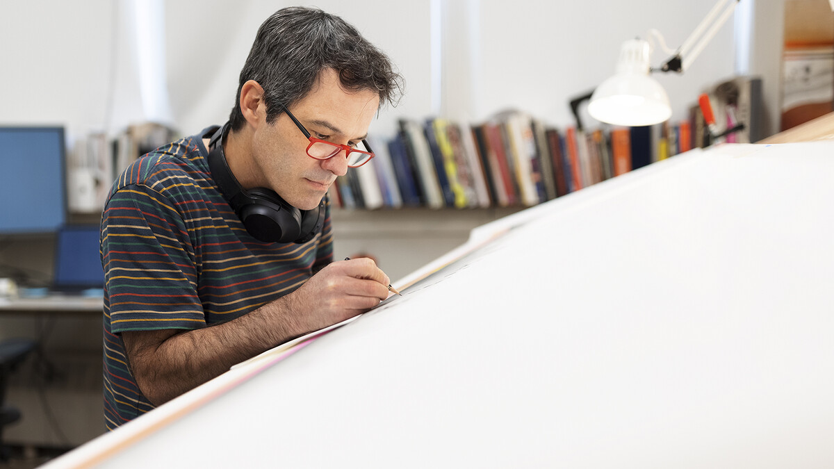 Francisco Souto works on "We Are Nebraska" in his Richards Hall studio on May 13, 2021. The 2-foot-tall by 8-foot-wide artwork took 17 months to complete.