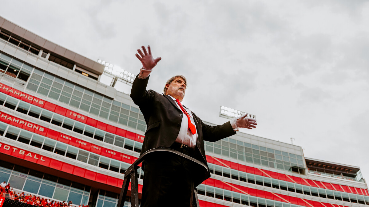 Tony Falcone—the associate director of bands—conducts the band during the NU v. OK game.