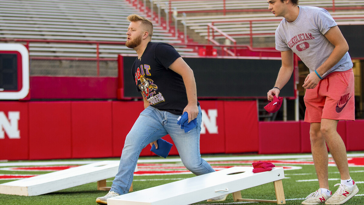 Nik Ostrovski throws during the Homecoming Cornhole Tournament in Memorial Stadium Sept. 29.