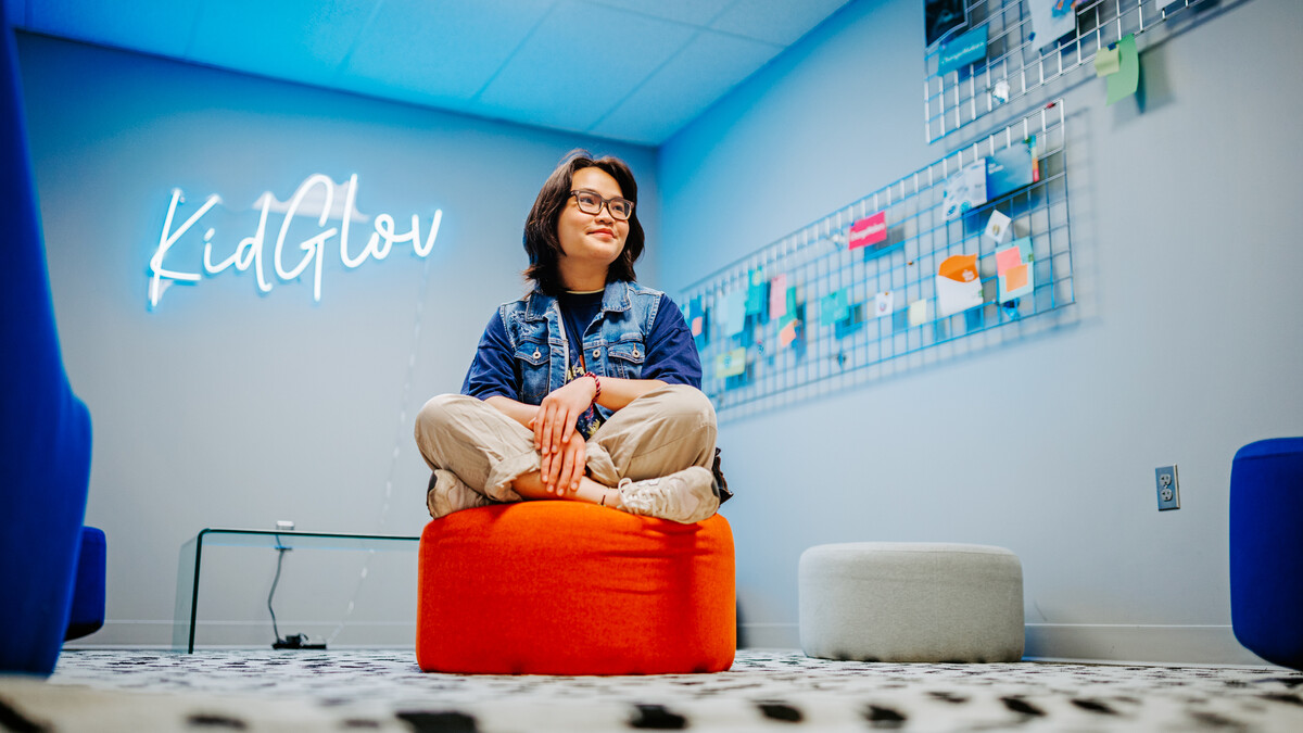 Mai Vu poses for a photo in the College of Journalism and Mass Communications' Experience Lab