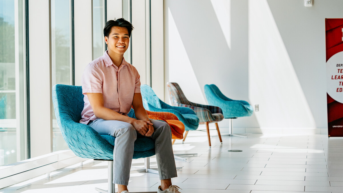 Photo by Jonah Tran // Andre smiles for a photo inside the Gwendolyn A. Newkirk Human Sciences Building