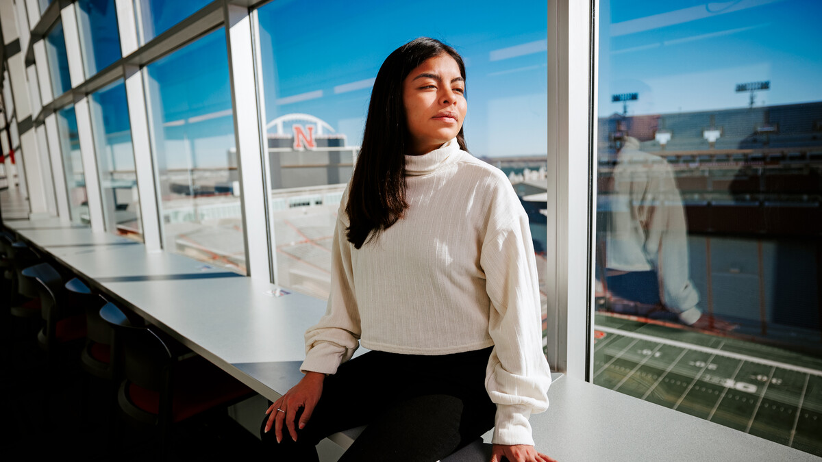 Photo Credit: Craig Chandler // Marissa Kraus looks across Tom Osborne Field from the media box in Memorial Stadium