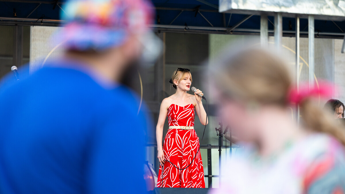 Caity Gyorgy is visible between two dancers as she sings a faster-paced swing tune during Jazz in June on Tuesday, June 10.