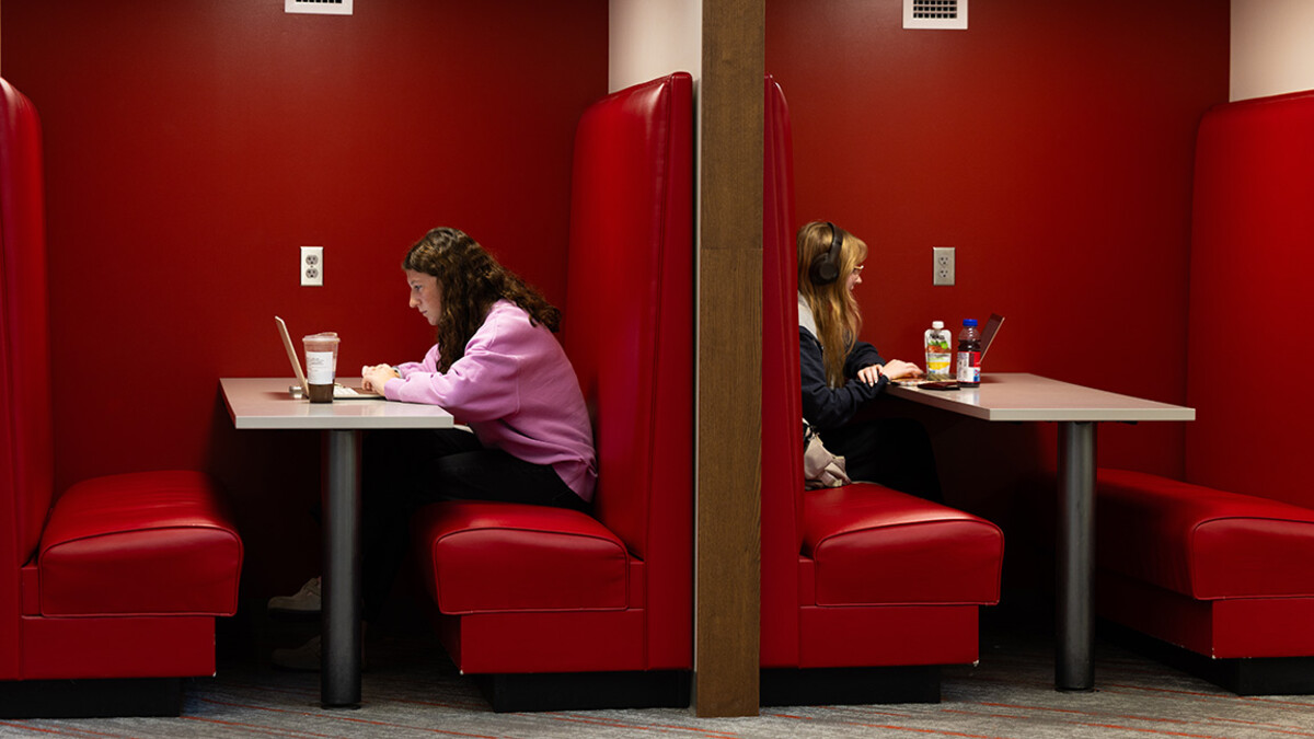 Brooklyn Steffen (left), a first-year student majoring in agribusiness, and Josephine Browning, a senior majoring in statistics, studying in cozy booths in the Nebraska East Union.