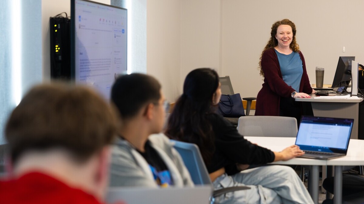 Allison Docter, one of the career coaches serving the College of Arts and Sciences, smiles while teaching during her class, "Career Ready, Life Ready." This is the first semester the class has been offered to seniors to help them prepare for life after college.