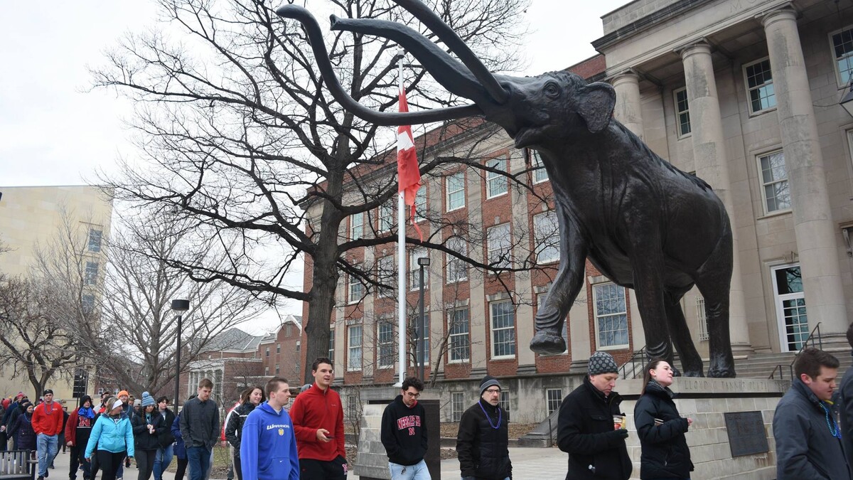 UNL Students walk by Morrill Hall during the 2018 Out of the Darkness Walk. Photo by Marcella Mercer.
