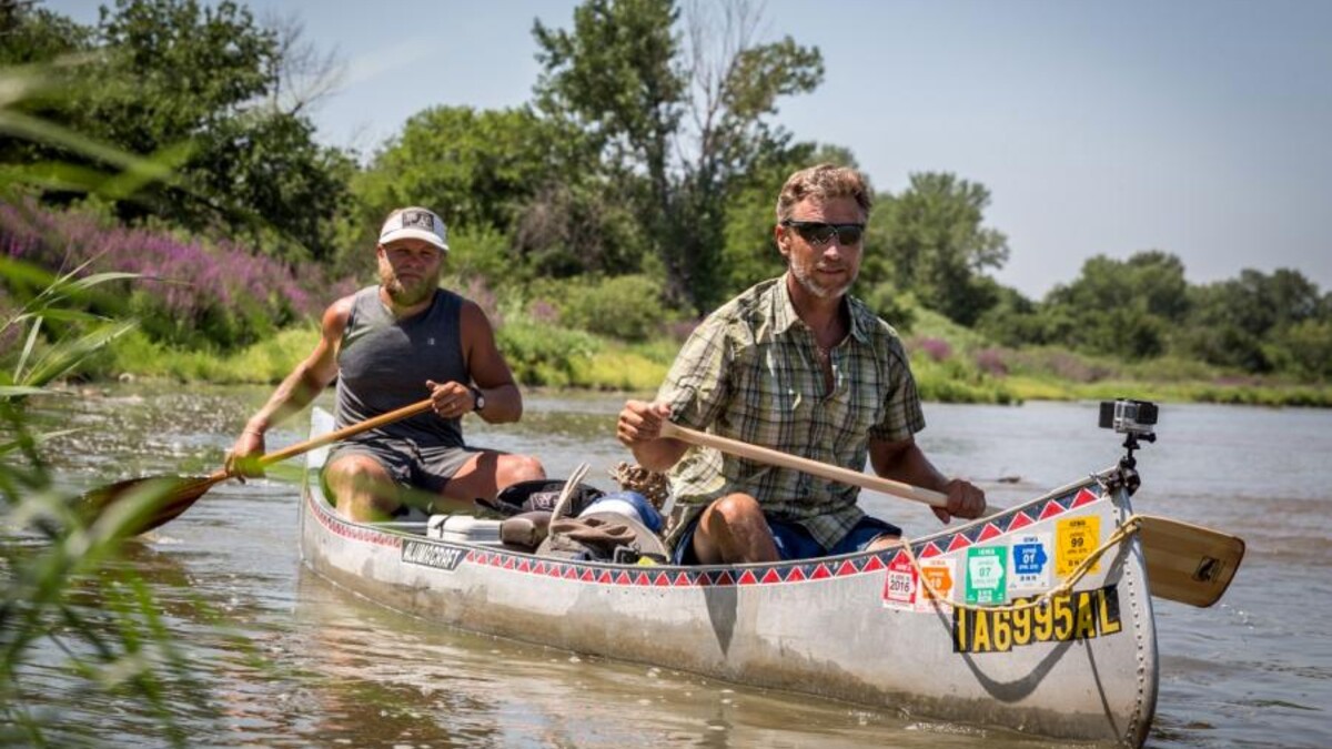 Mike Forsberg and Pete Stegen canoe down the Platte River during filming of the "Follow the Water" documentary.