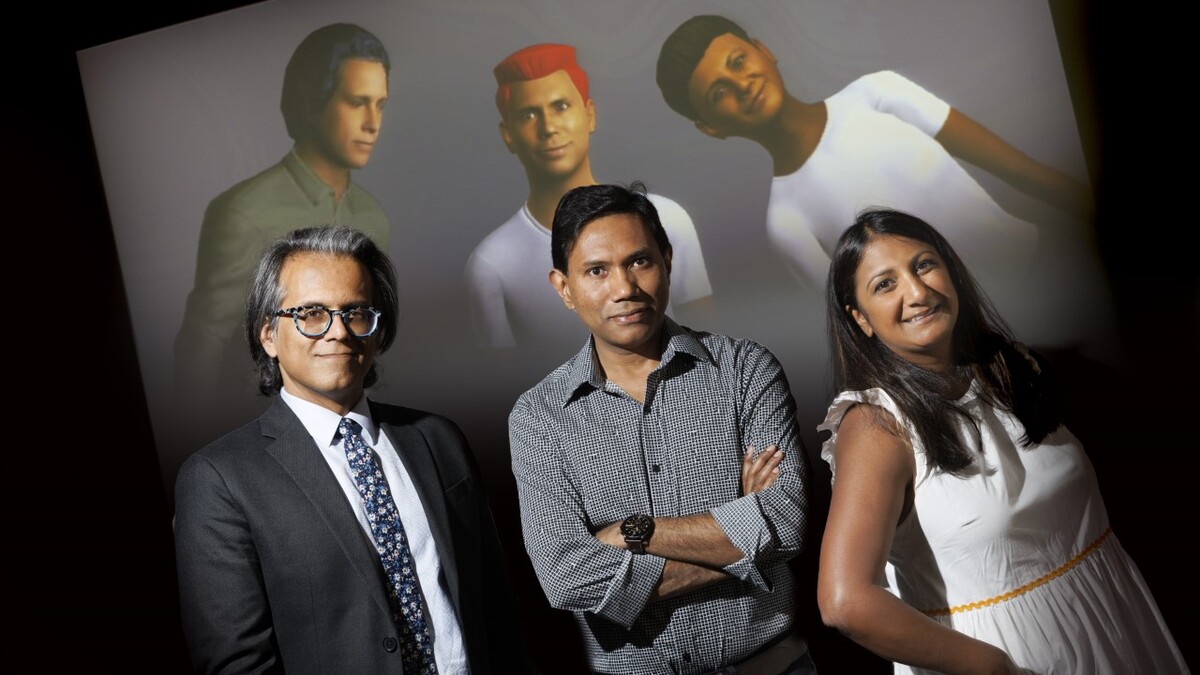 Bilal Khan, Mohammad Hasan and Neeta Kantamneni standing in front of a screen with their digital doppelgangers