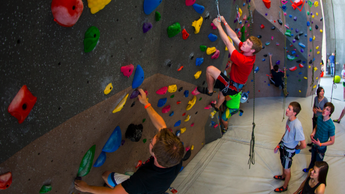 Students try out the new Outdoor Adventures Center climbing wall during the May 1 open house. The facility opens to the public today (May 5).