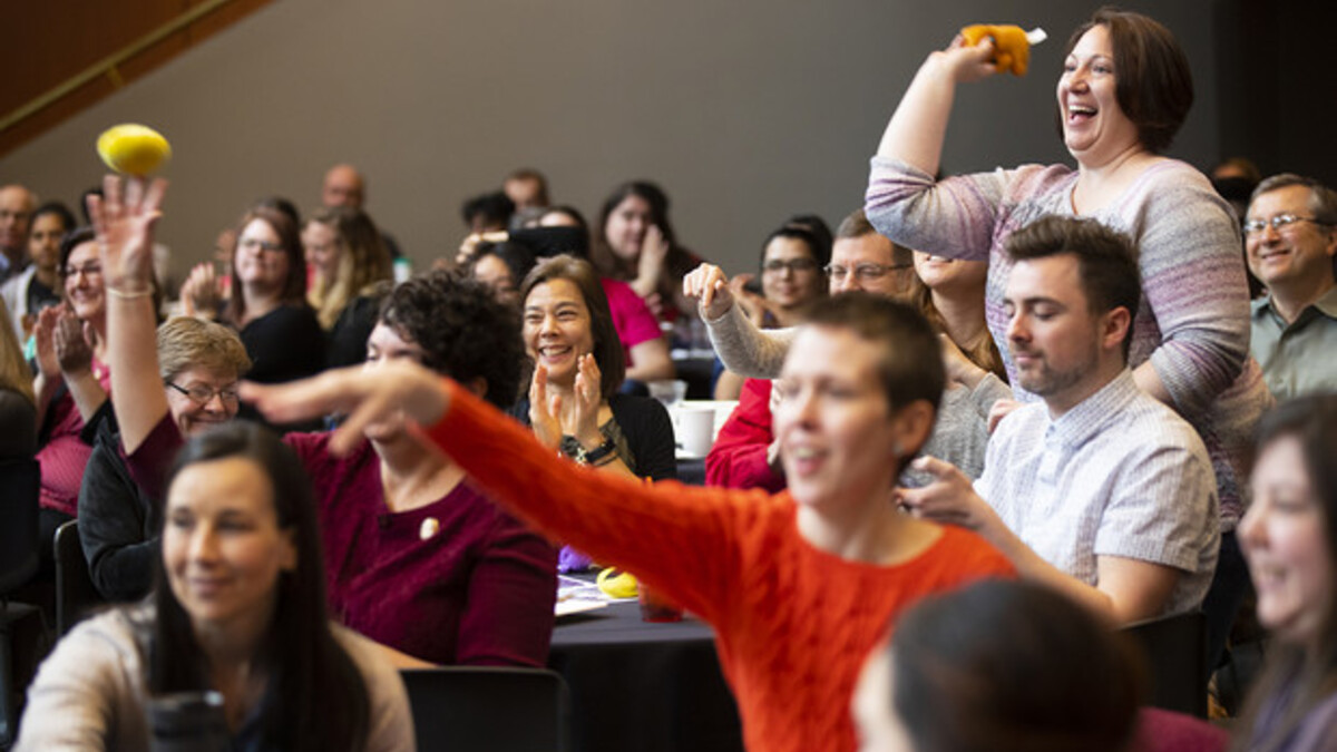 The crowd cheers and throws teddy bears at the 2019 Science Slam.