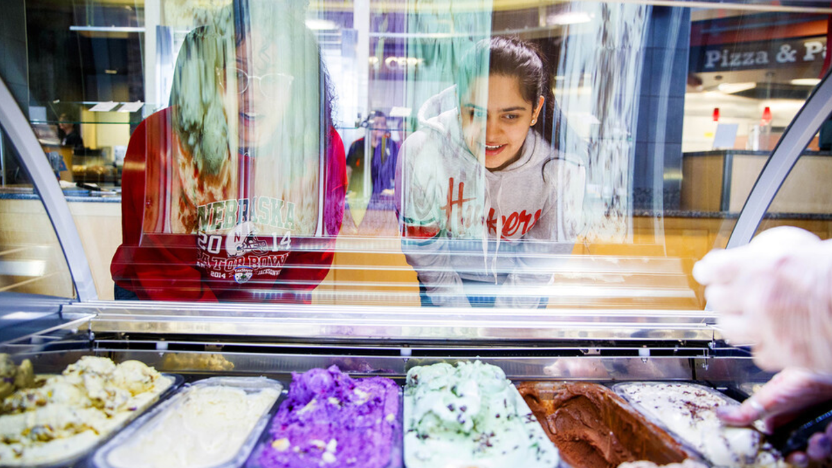 Students pick out gelato in the Abel-Sandoz Dining Center in this photo taken before face coverings were required when indoors on campus. The university has expanded availability of dining options for students this semester.