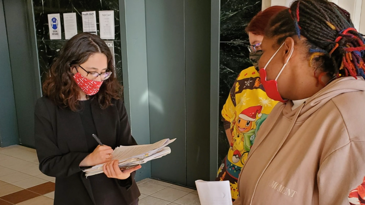 A Nebraska law student consults with a Lincoln resident as part of the College of Law's Tenant Assistance Project.