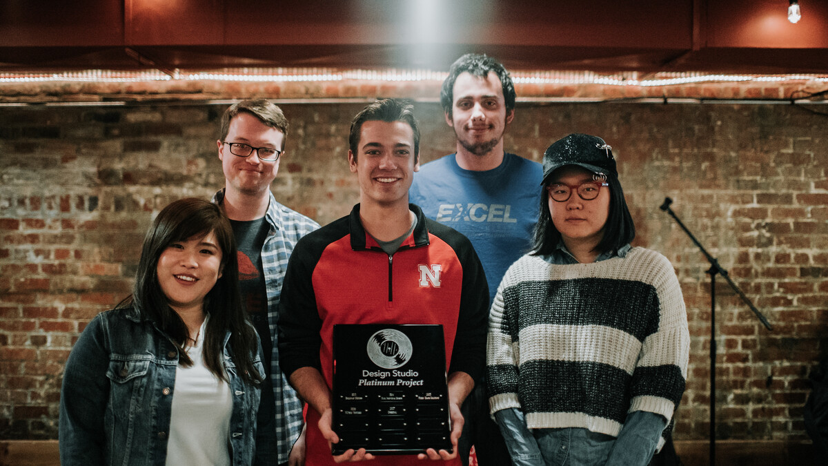 Design team Sensi-Plate accepting its platinum award earned during the 2018 Senior Design/Design Studio Showcase.