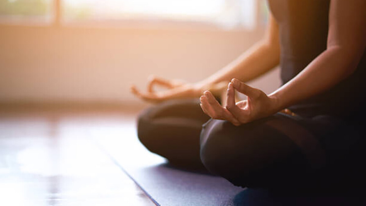 A person holds a yoga pose.